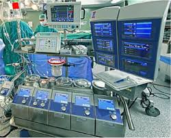 A perfusionist in surgical scrubs monitoring a heart-lung machine, ensuring proper blood flow and oxygenation during cardiac surgery.