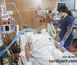 Nurse caring for post-operative cardiac surgery patient in ICU.